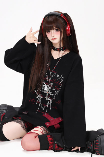 Maglione con scollo a V e farfalla
