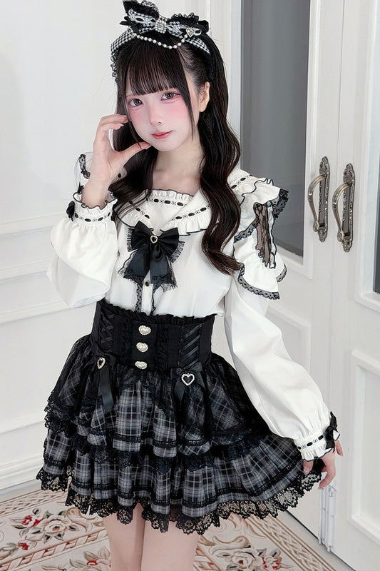 Conjunto de camisa con volantes y falda de cuadros