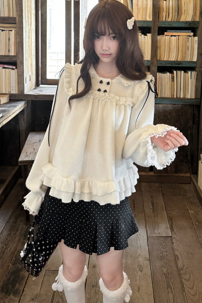Cremefarbenes Strickoberteil mit Bubikragen