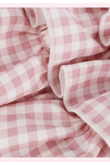 Top rosa femminile + gonna a balze a quadri