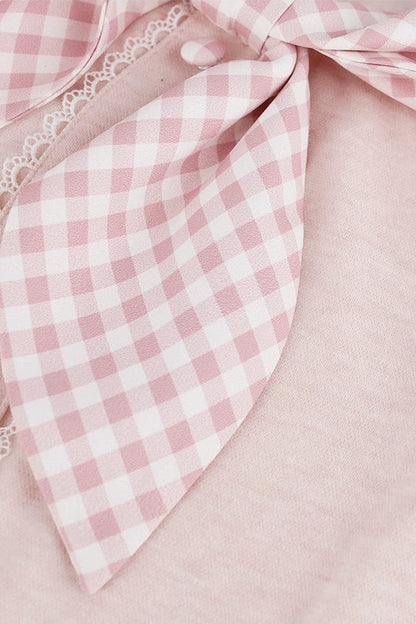 Top rosa femminile + gonna a balze a quadri