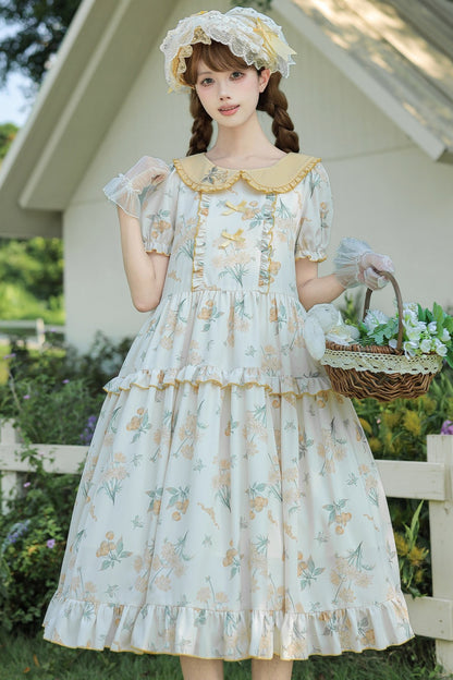 Kleid mit pastoralem Blumenprint und Bubikragen