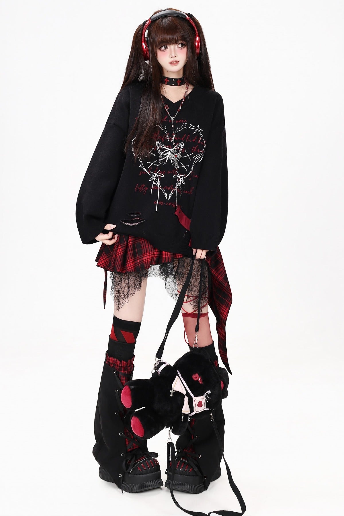 Maglione con scollo a V e farfalla