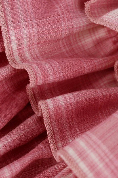 Rosa Oberteil im College-Stil + Stufenrock mit Schleife