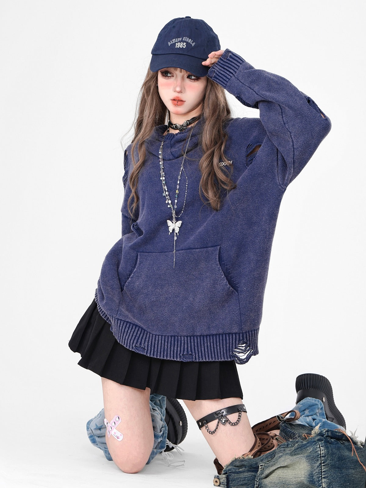 Damaged dark hooded knit top