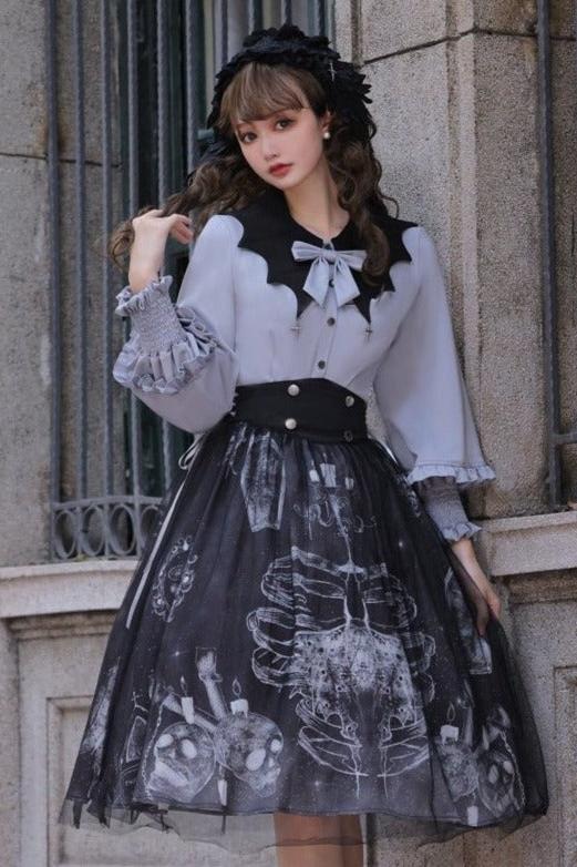 Cross motif bucket color ribbon blouse + side lace -up skirt