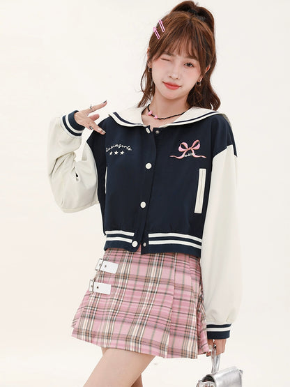 Navy-colored short stadium jacket + checked skirt