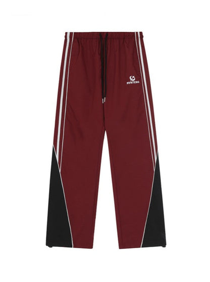 Straight sports pants with side stripe design