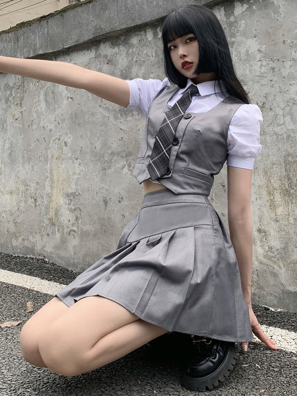 Check tie plain shirt + double breasted vest + asymmetric pleated skirt