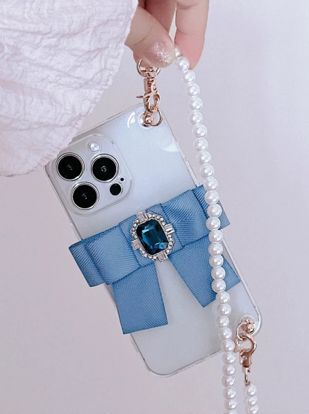 Étui pour téléphone portable avec chaîne de perles et strass et ruban bleu