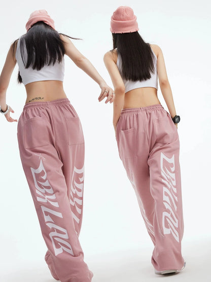 Pantalon de survêtement rose sale avec logo